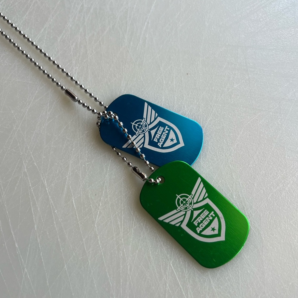 Blue and green dog tags